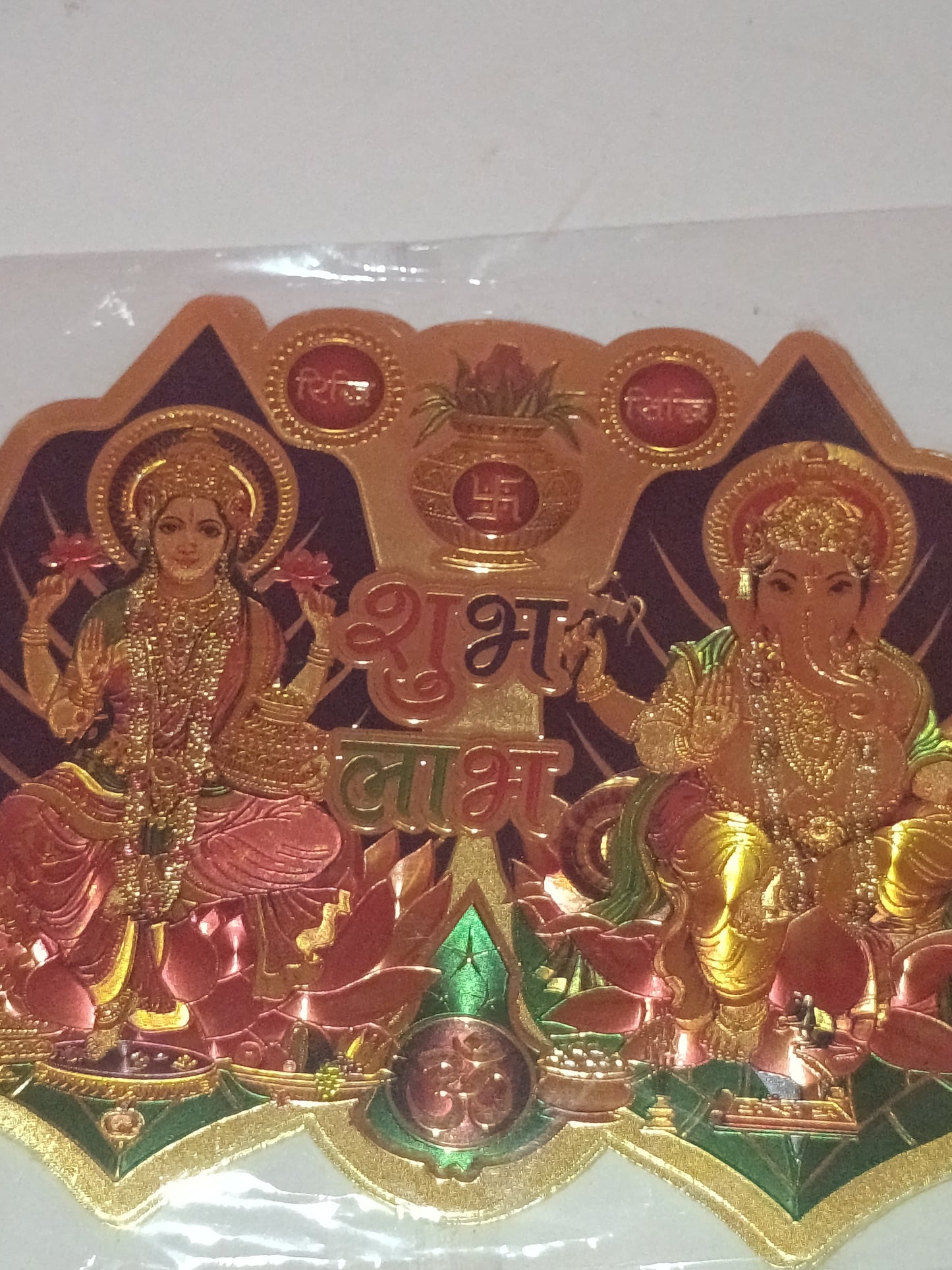 Metallic sticker featuring the deities Lakshmi and Ganesha 1pcs